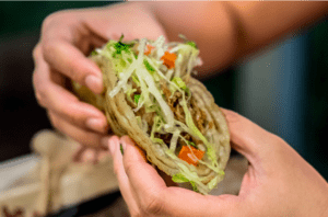 hands holding a taco