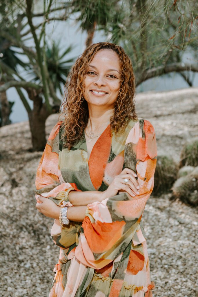 woman arms crossed smiling looking at camera